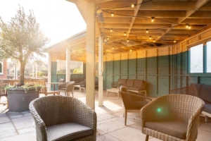 The Bear's pub garden in Rugby with fixed roofing catching the sunlight
