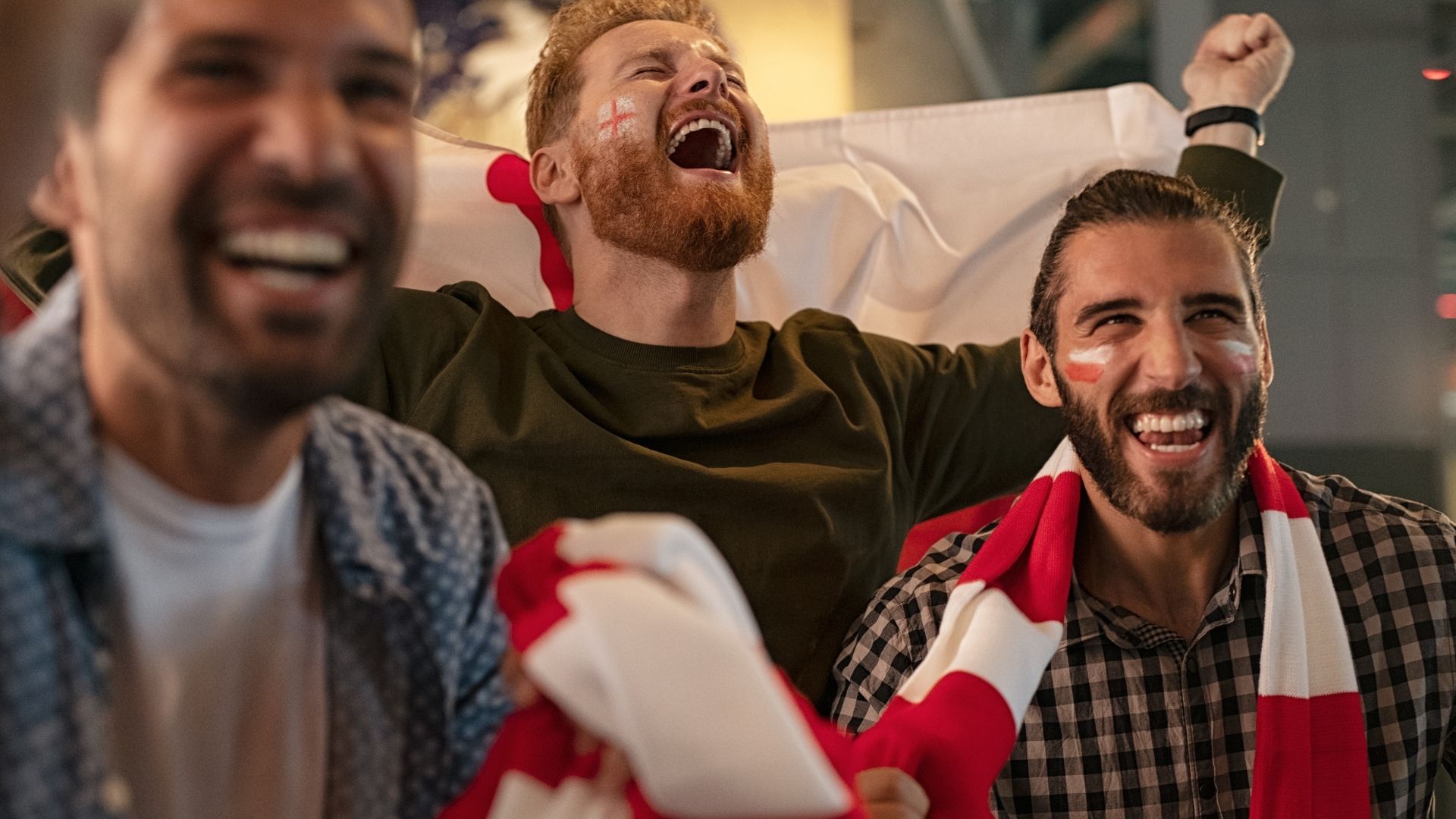 Rugby fans watching the Six Nations cheering at the bear