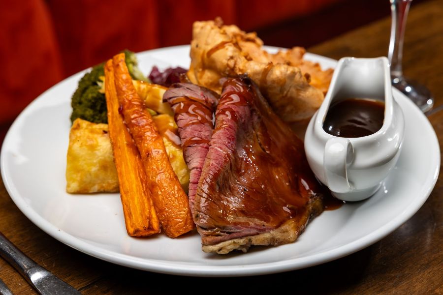 Sunday Roast with Roast beef, a giant yorkshire and all the trimmings