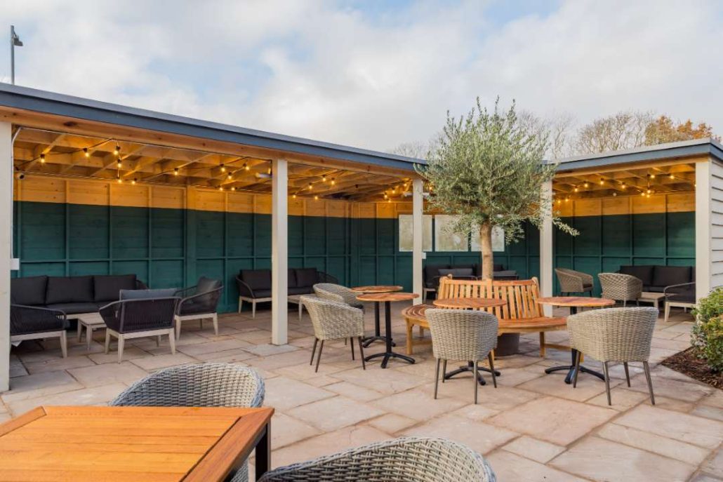 Outside dining in pub garden with covered areas