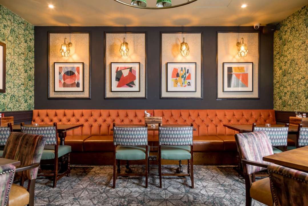 Semi private dining room at The Bear - with backbench seating and normal tables